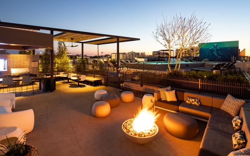 Outdoor patio and fire pit lounge at NOVEL Edgehill apartments Nashville.