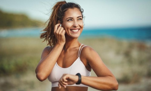 woman out for exercise at the beach