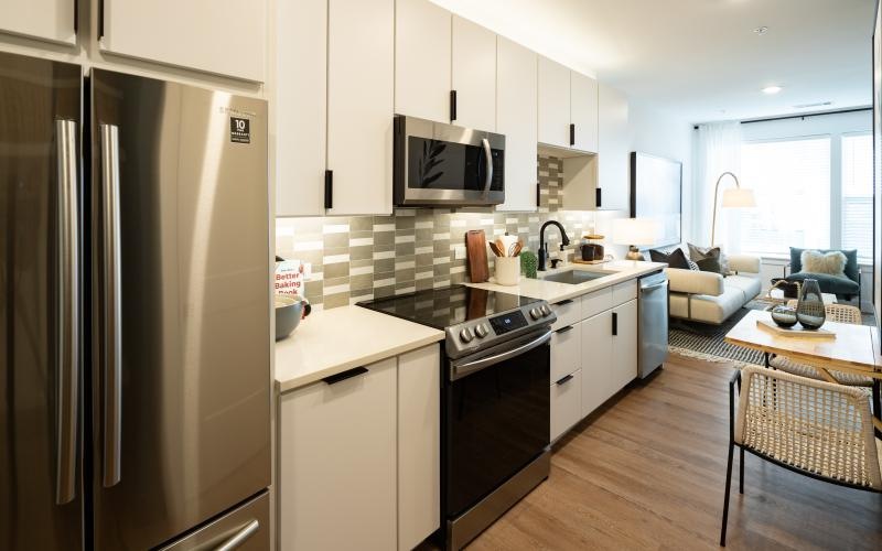 Modern kitchen with stainless steel appliances at NOVEL Edgehill apartments Nashville.